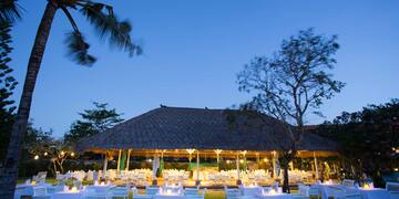 a group of tables and chairs outside a building