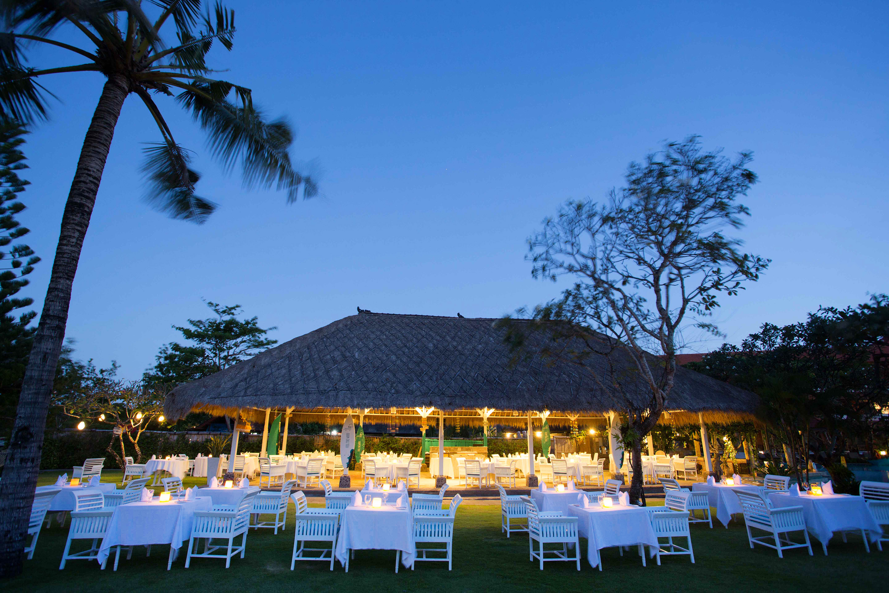 a group of tables and chairs outside a building