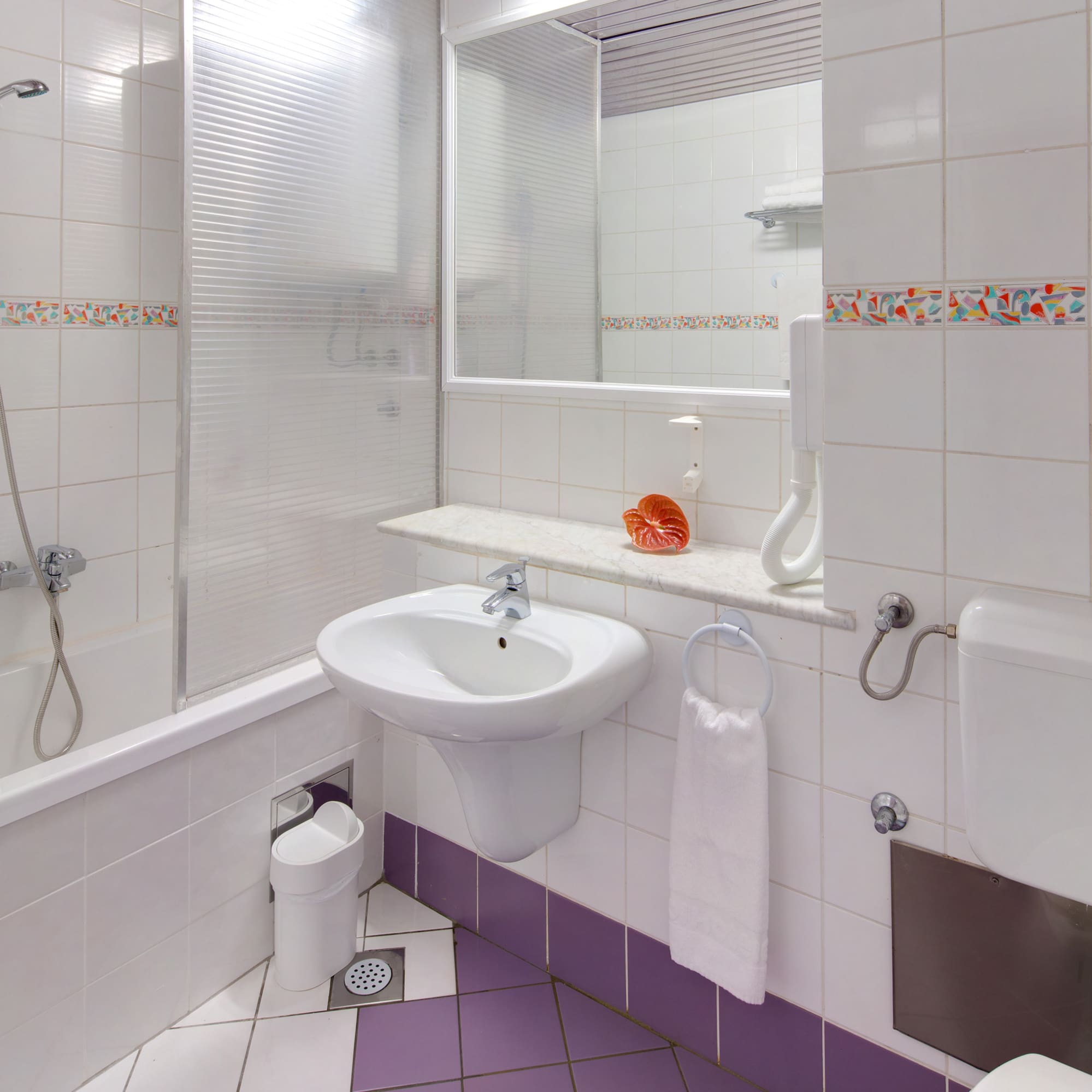 a bathroom with a sink and toilet