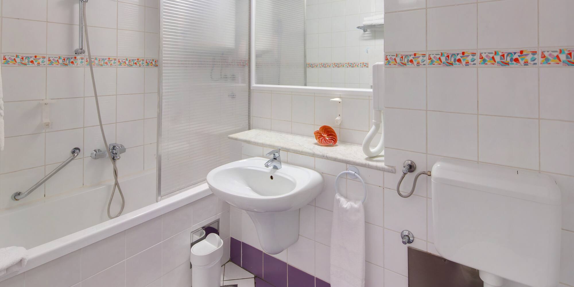 a bathroom with a sink and toilet