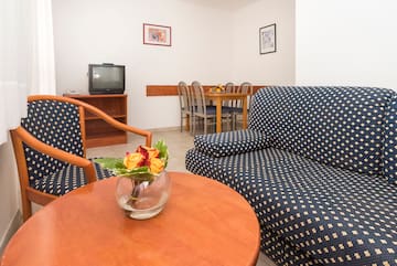 a room with a couch and a television