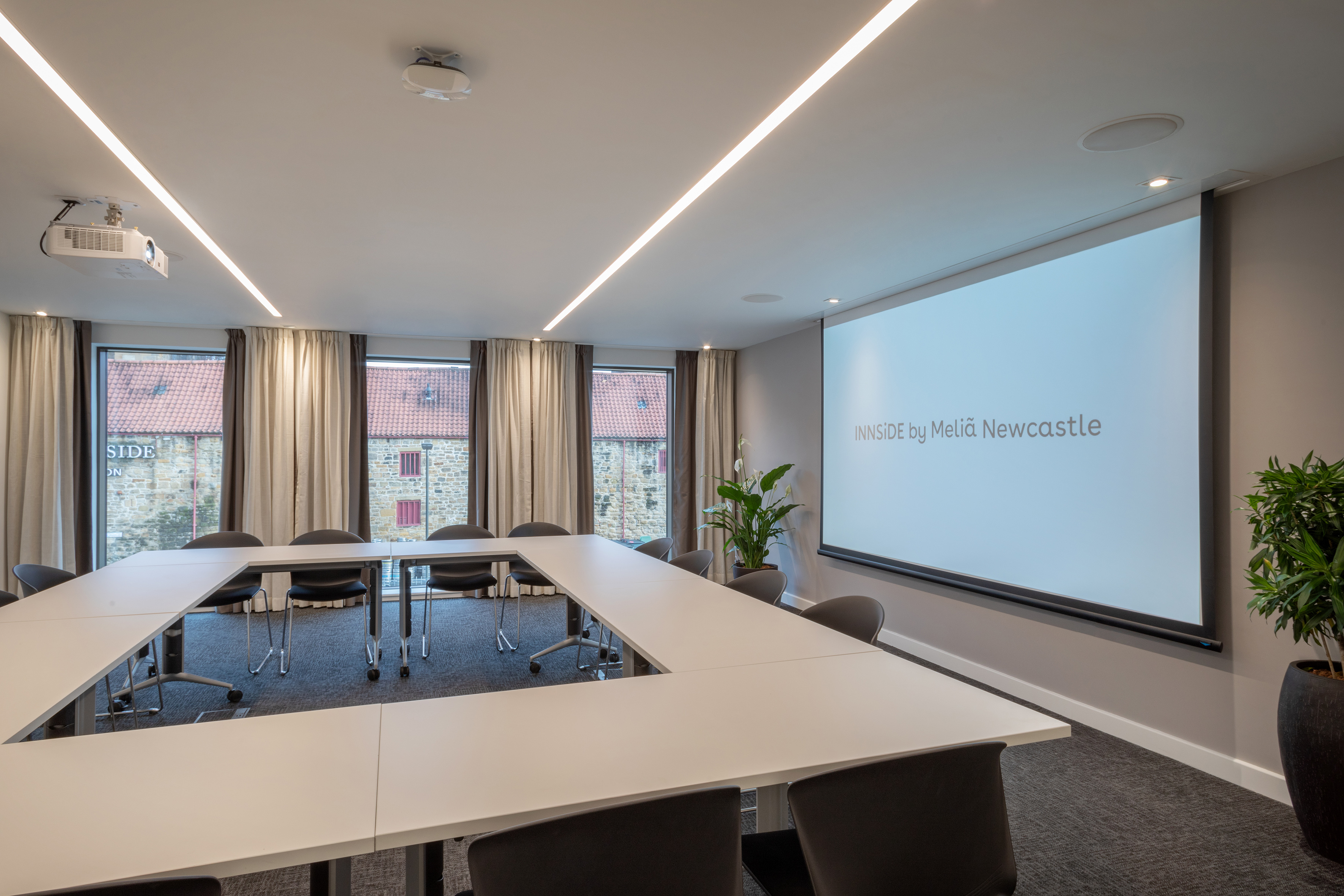 a room with a projection screen