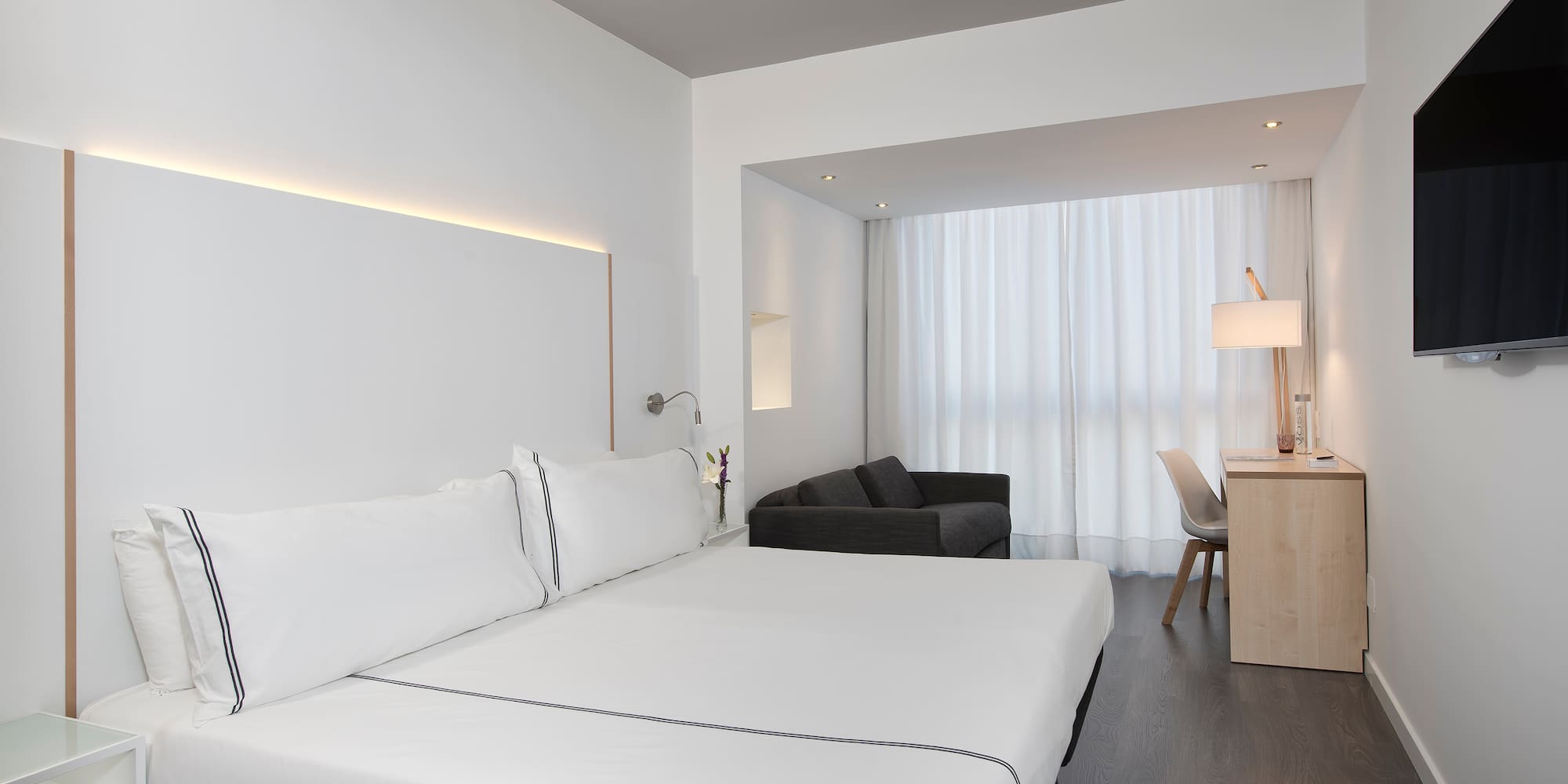 a room with a bed and a desk