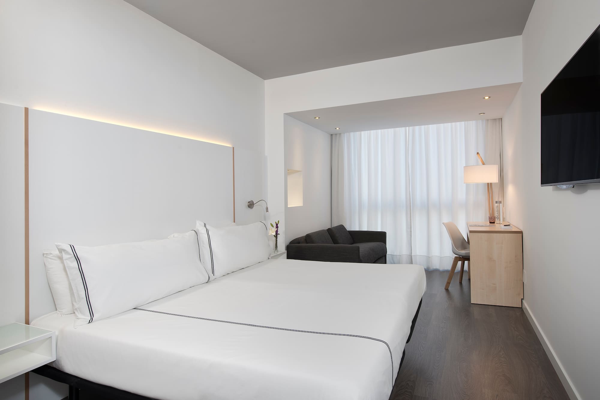 a room with a bed and a desk