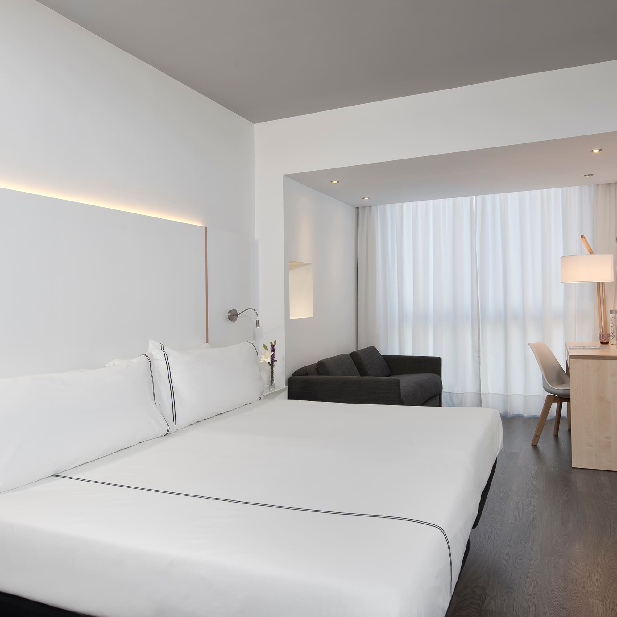 a room with a bed and a desk