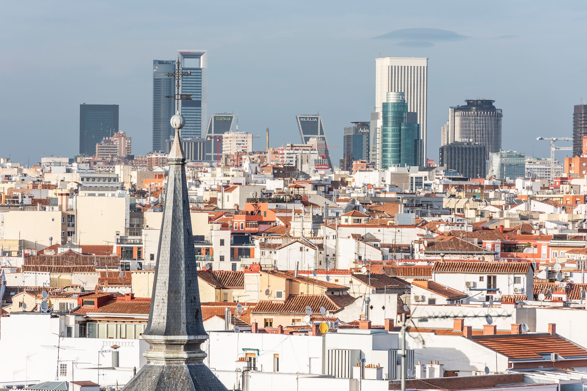 a city with a steeple and a city skyline