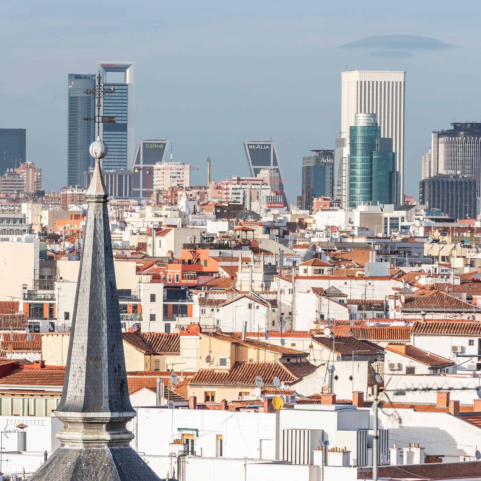 a city with a steeple and a city skyline