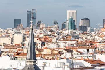 a city with a steeple and a city skyline
