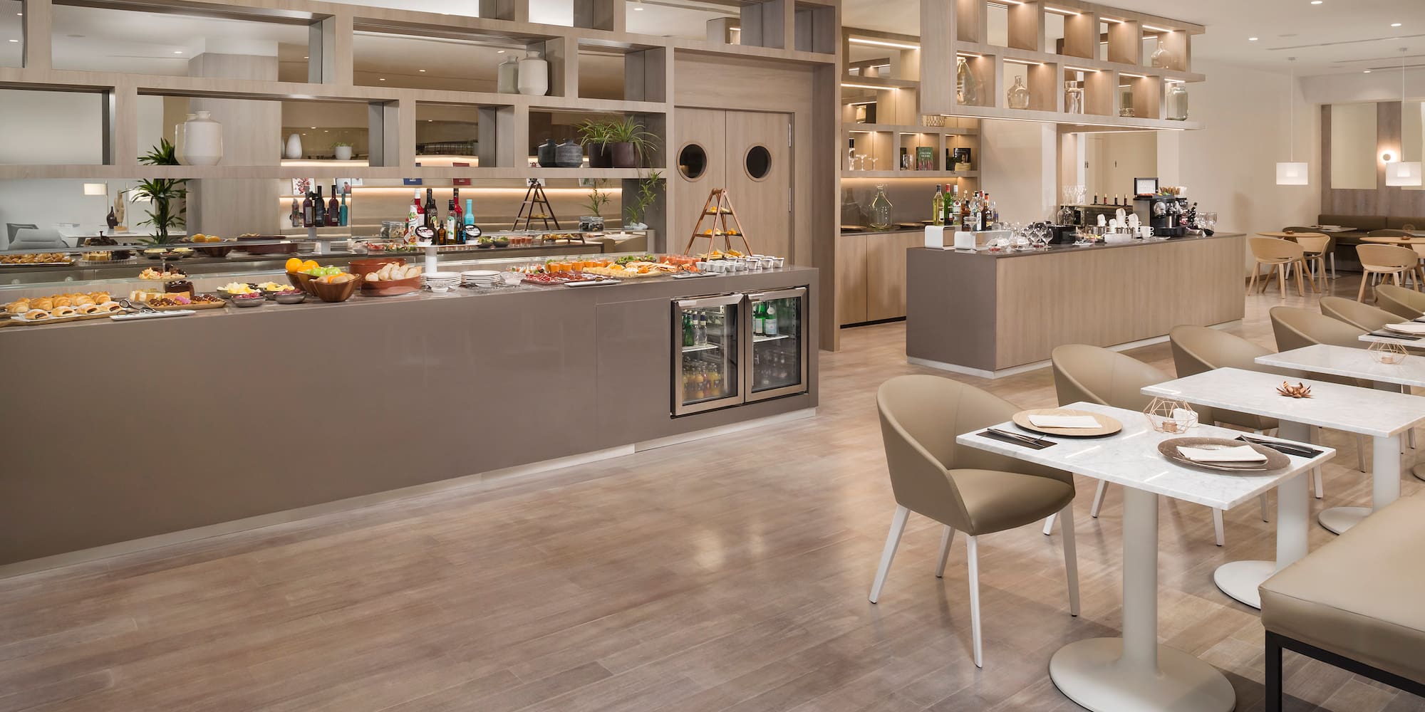 a restaurant with a buffet and a wood floor