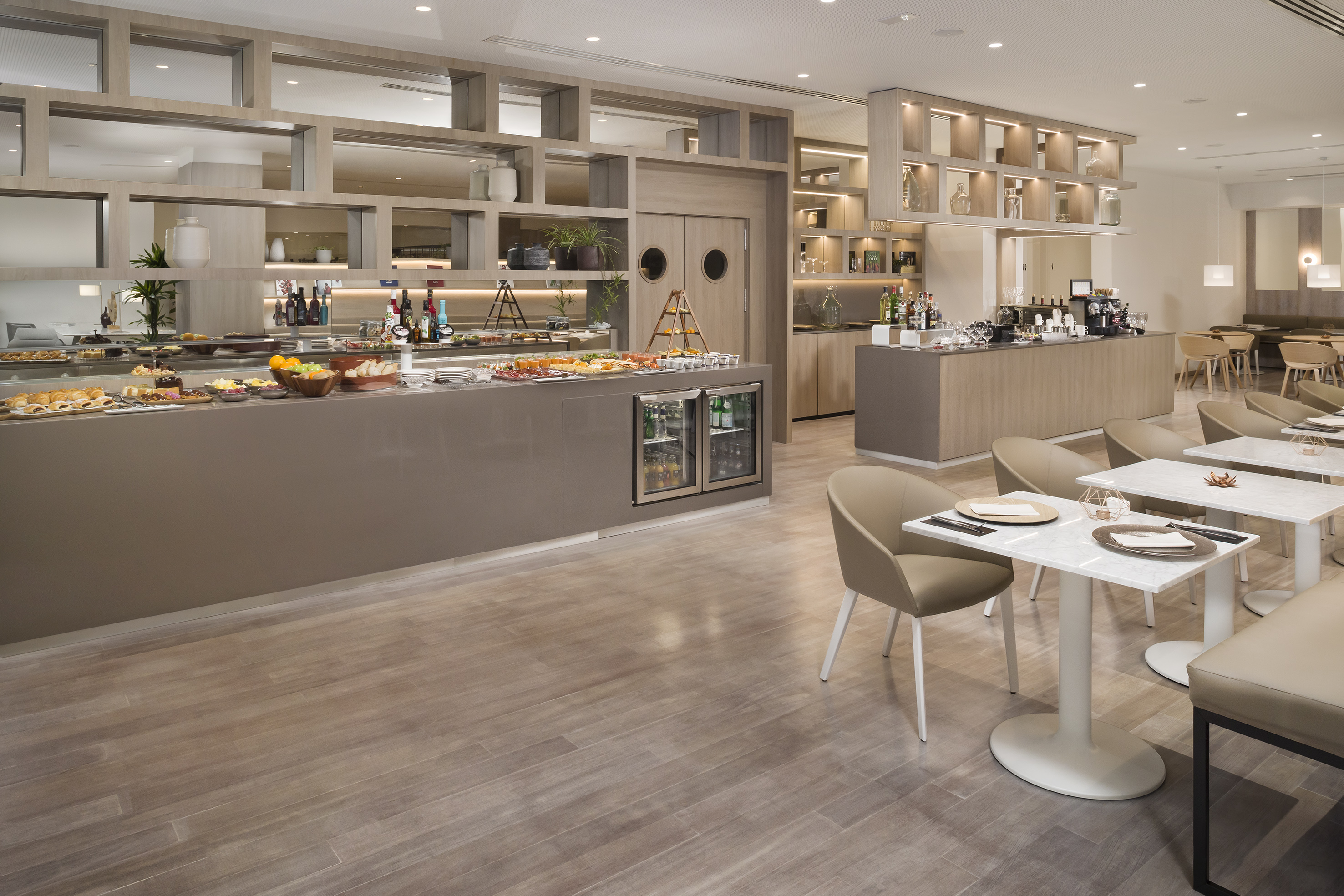 a restaurant with a buffet and a wood floor