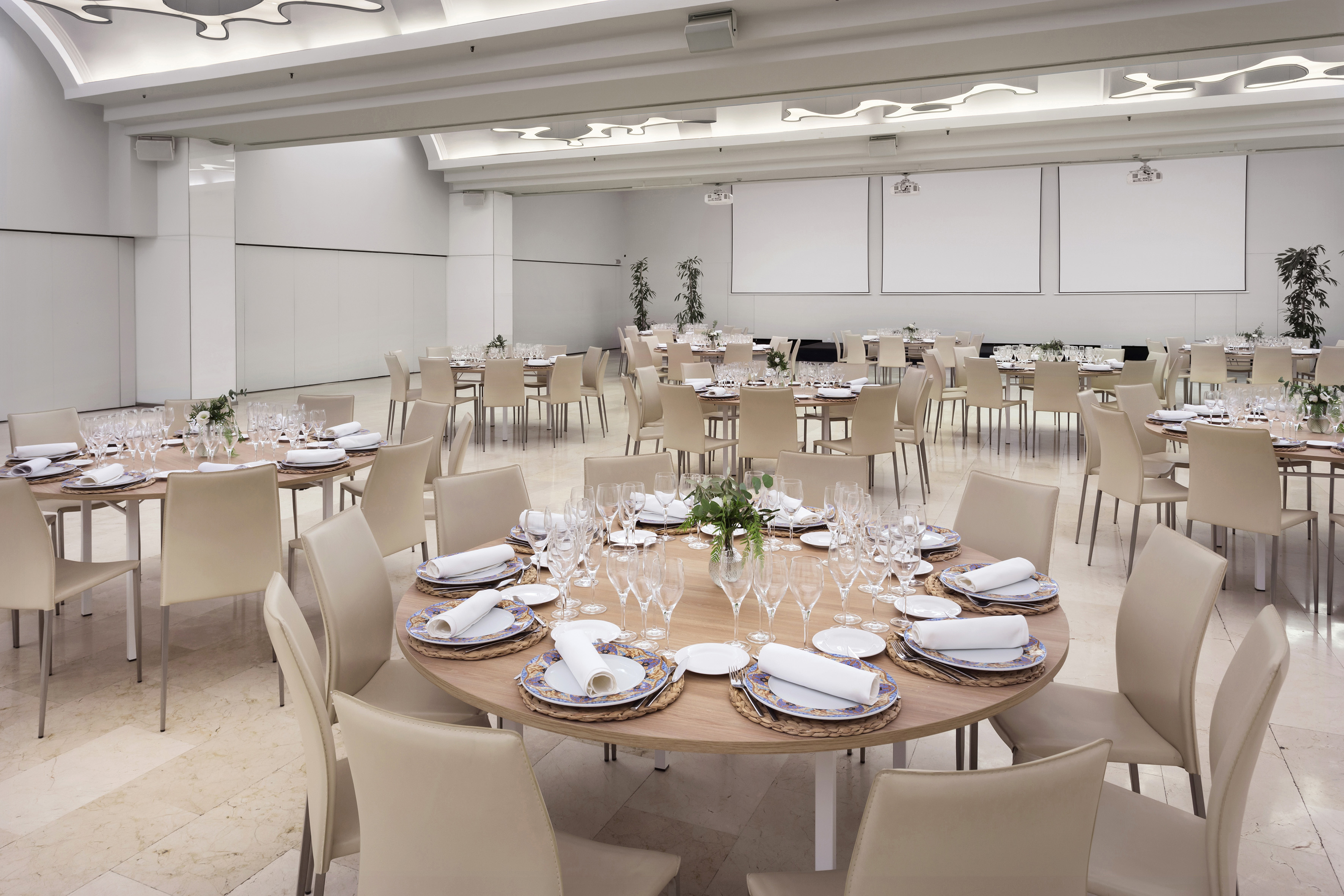 a large room with tables and chairs