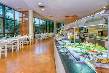 a buffet line with food on the counter