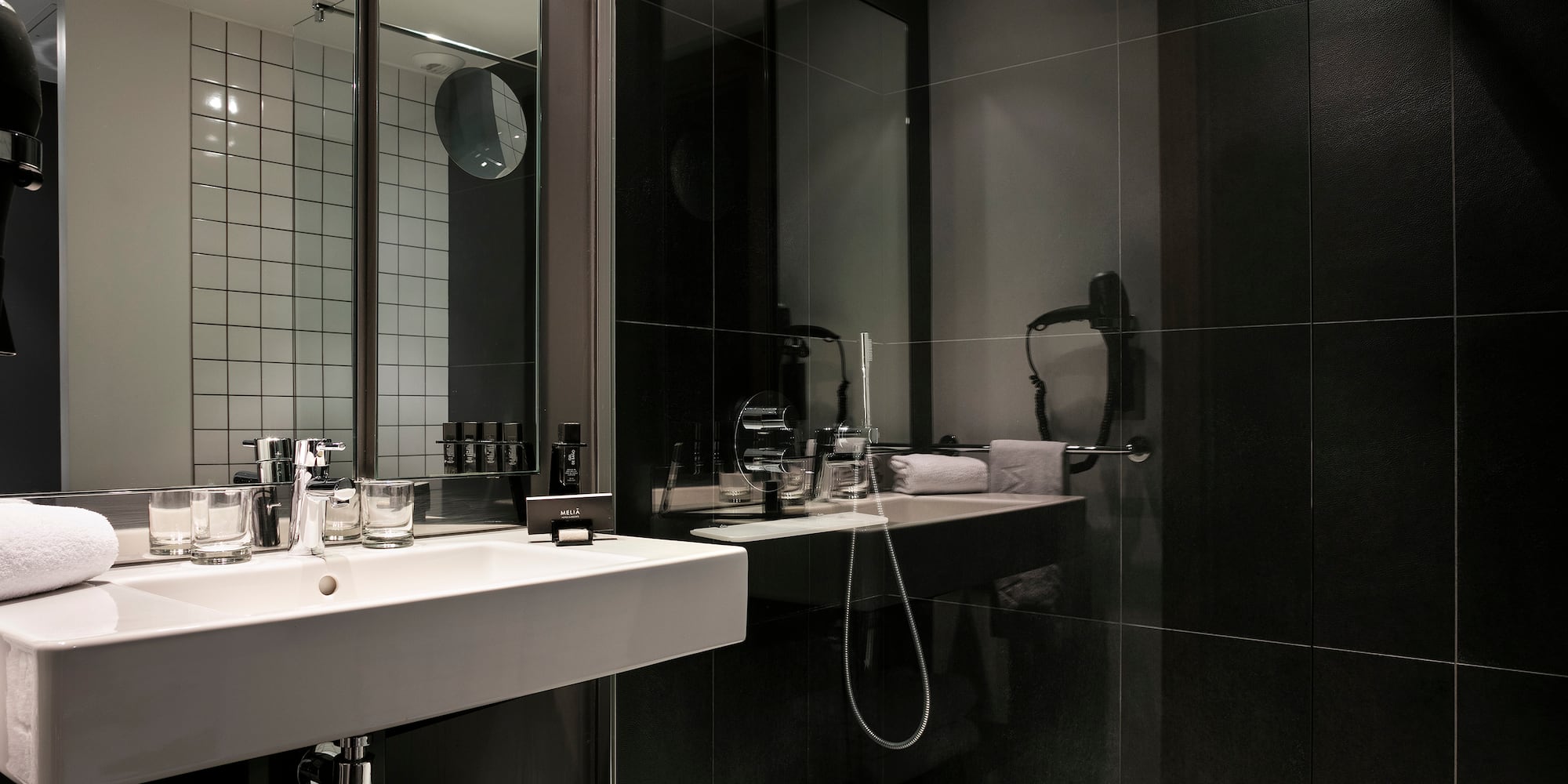 a bathroom with a shower and sink