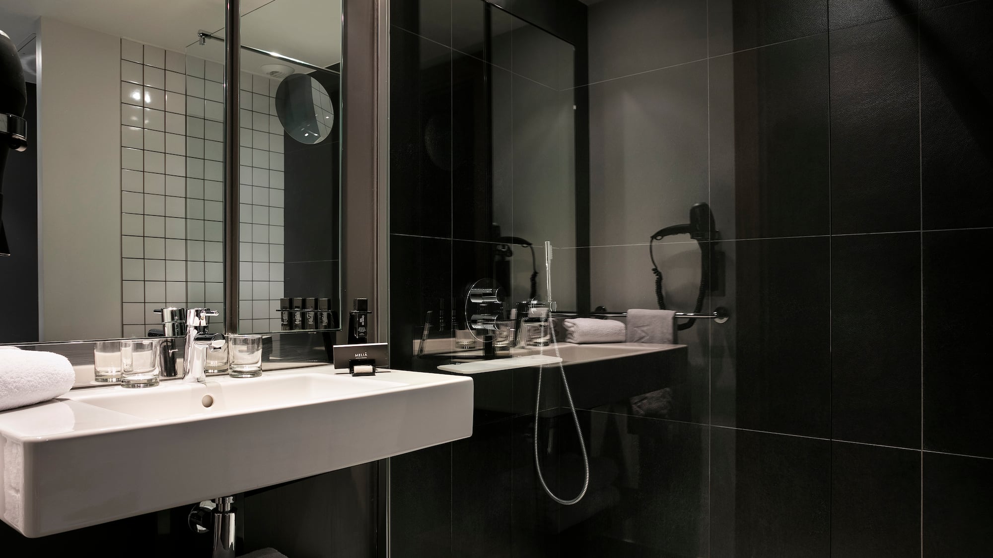 a bathroom with a shower and sink