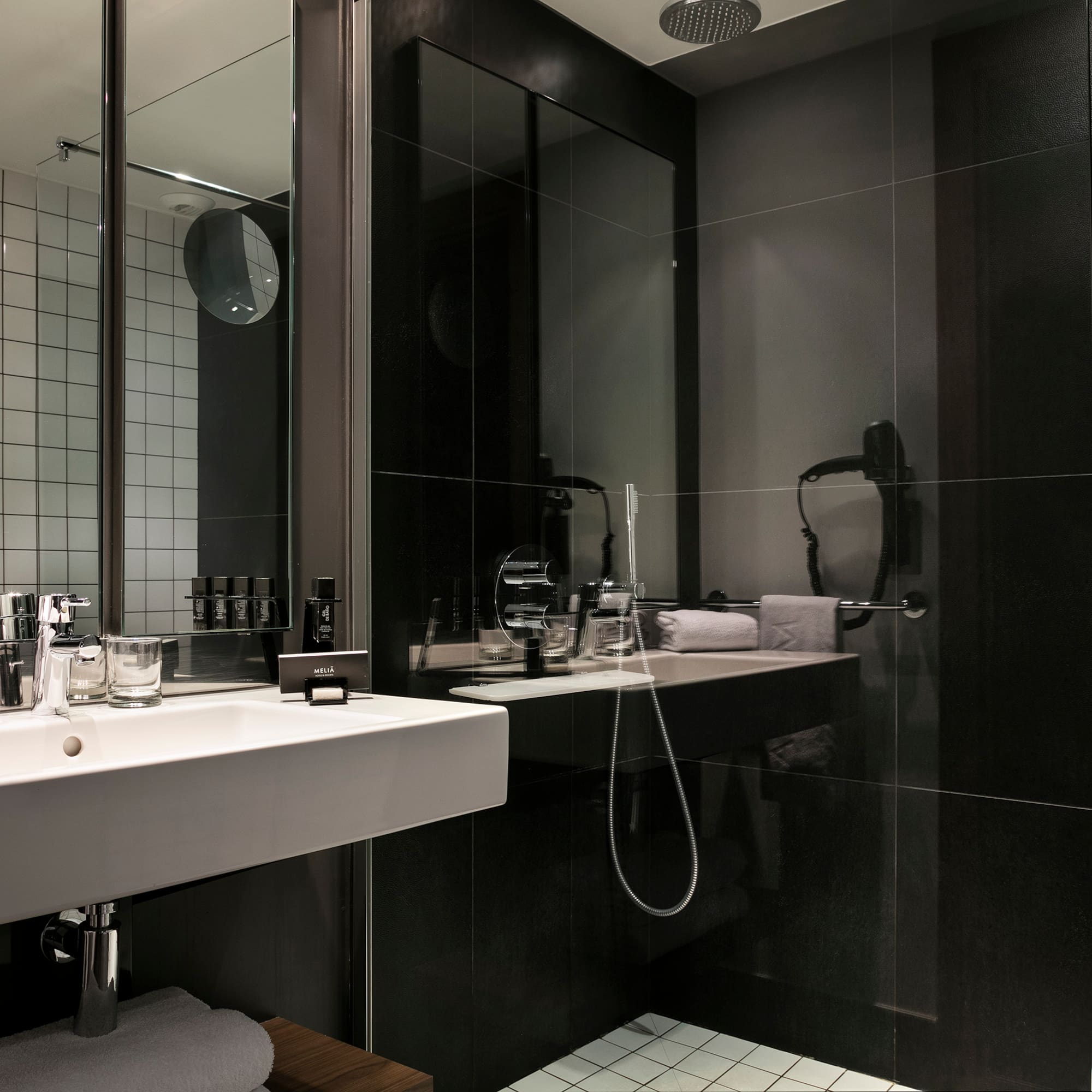 a bathroom with a shower and sink