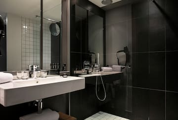 a bathroom with a shower and sink