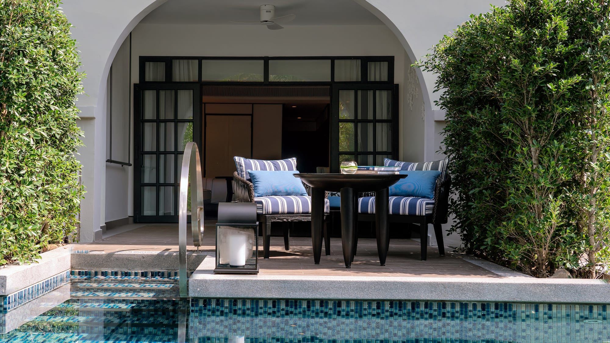 a pool with a table and chairs
