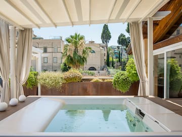 a hot tub with a white cover over it