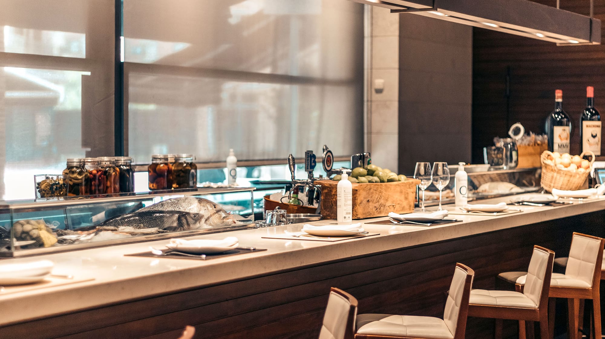a bar with a counter and chairs