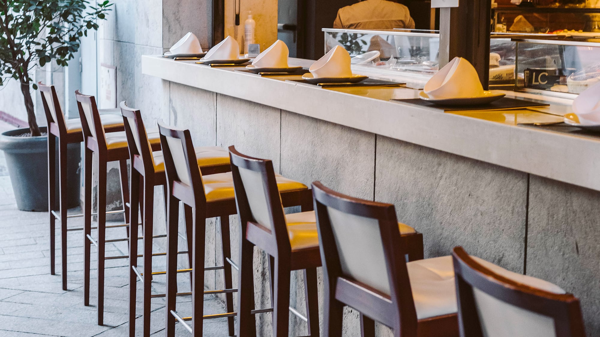 a row of chairs outside a restaurant