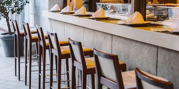 a row of chairs outside a restaurant