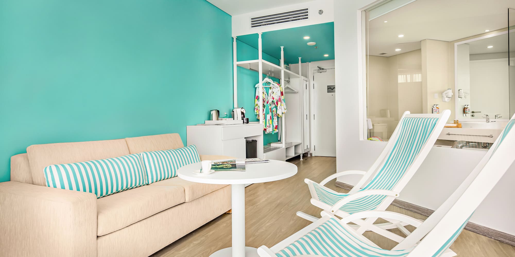 a room with a couch and chairs