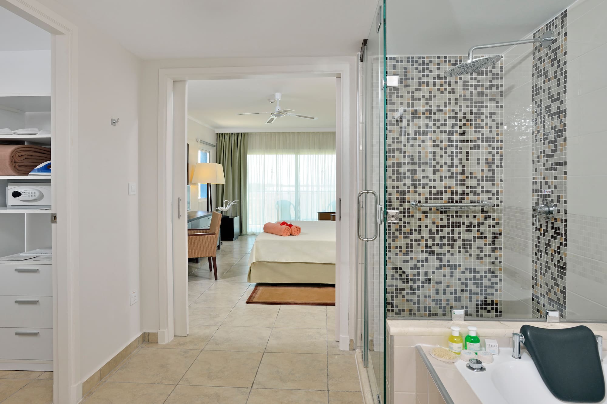 a bathroom with a shower and a bed