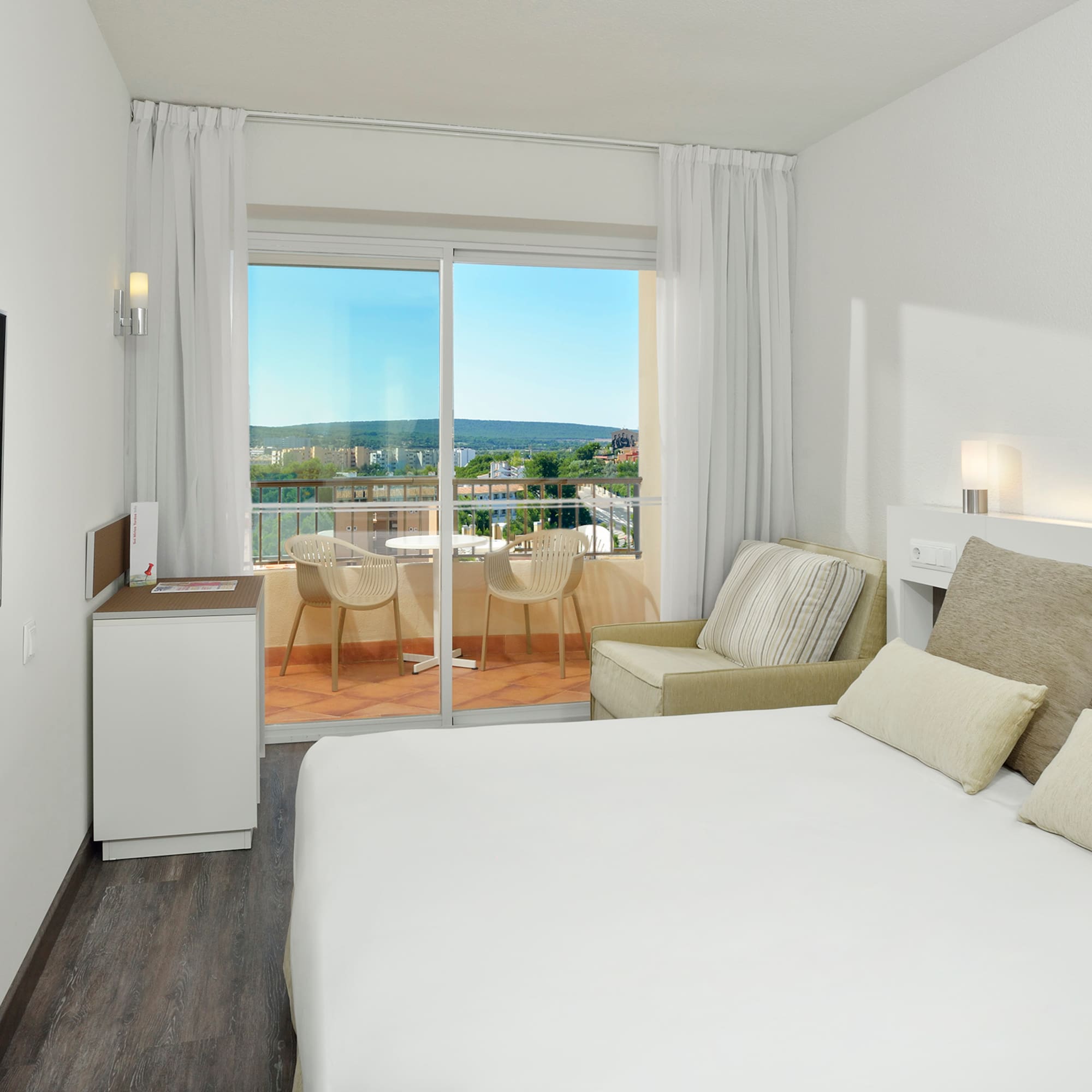 a bedroom with a bed and a television