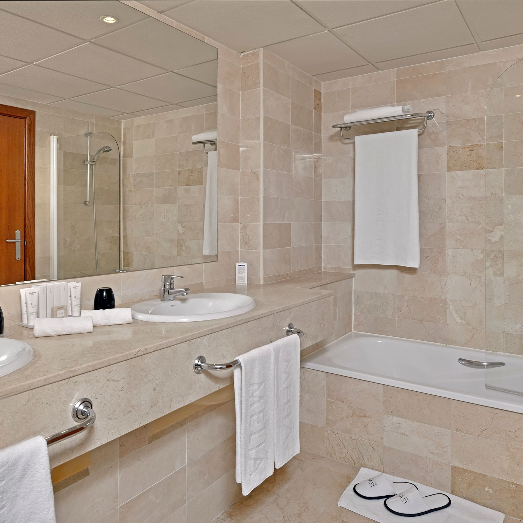 a bathroom with a bathtub and sink