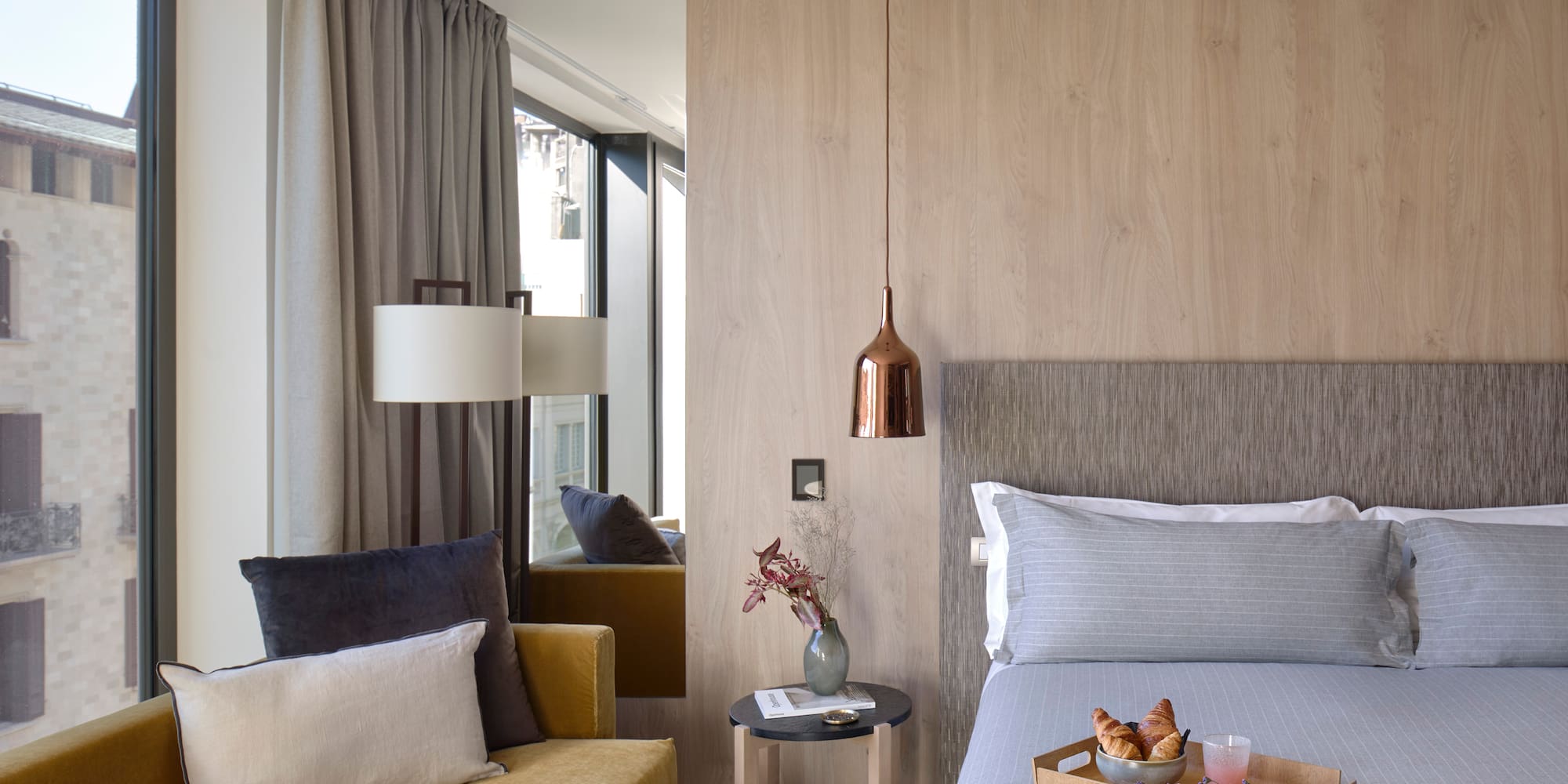 a bed with a tray of food on it