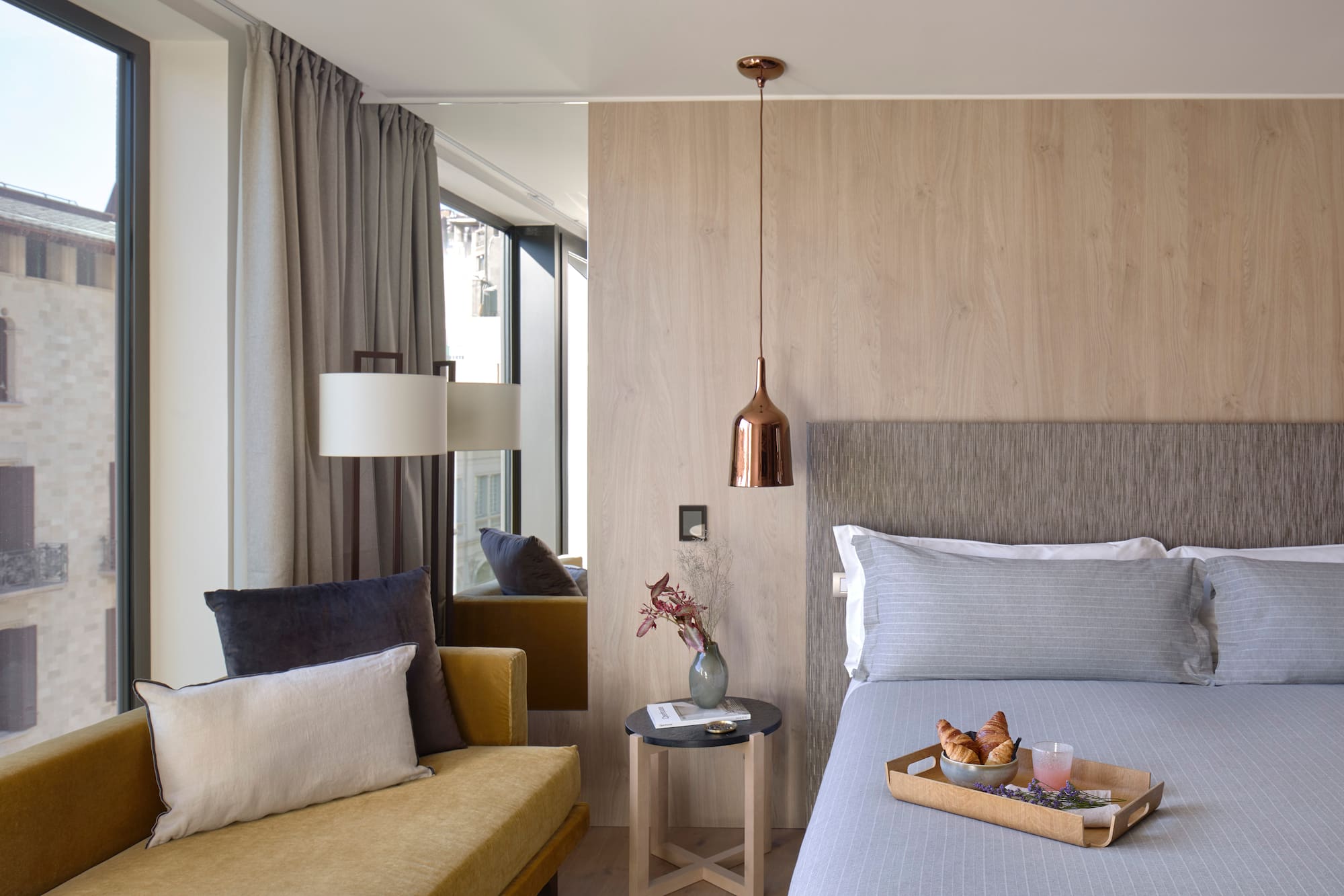 a bed with a tray of food on it