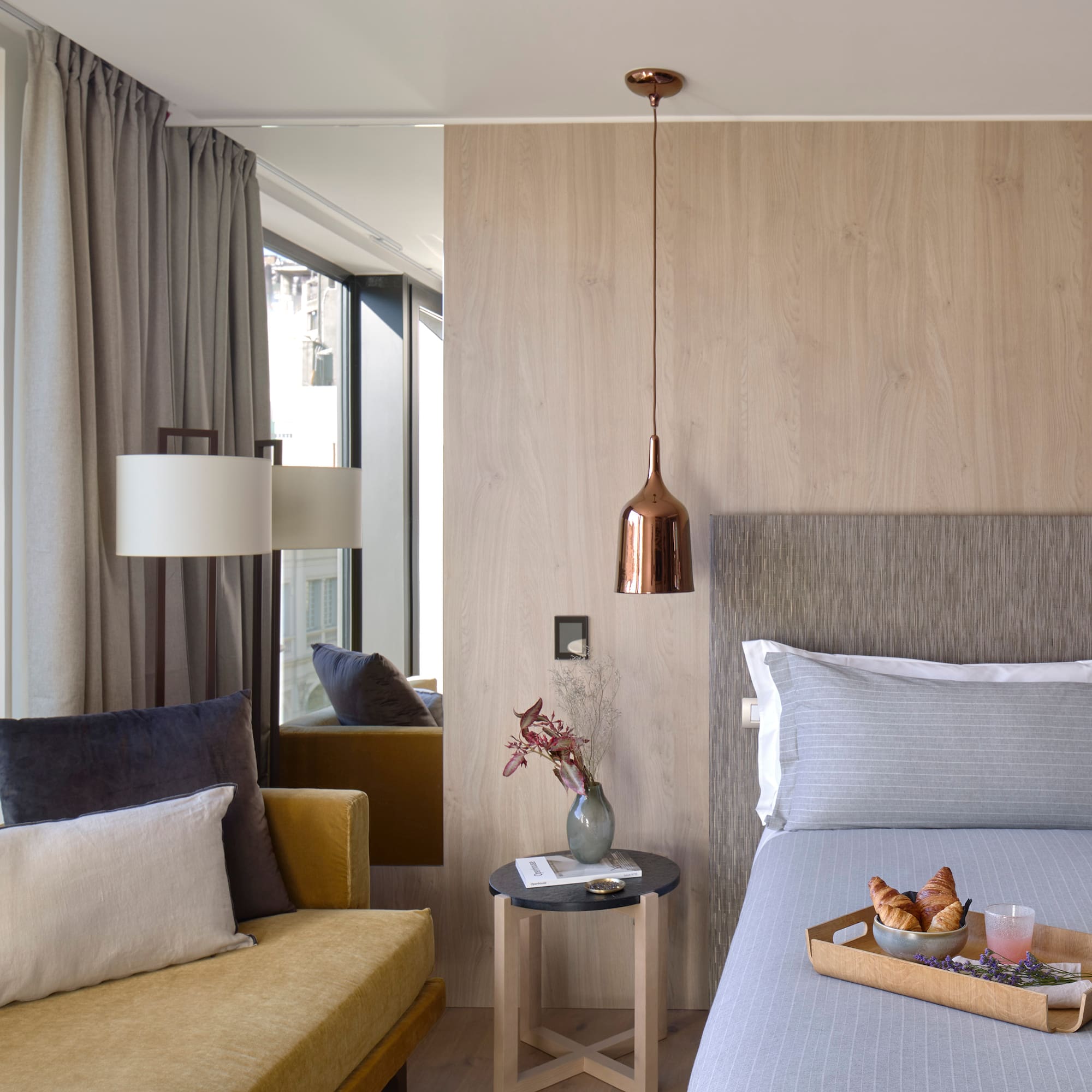 a bed with a tray of food on it