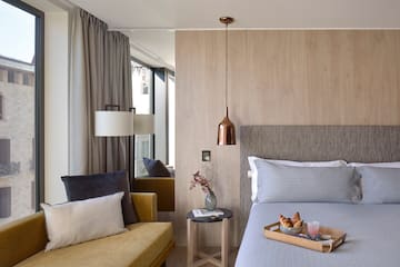 a bed with a tray of food on it