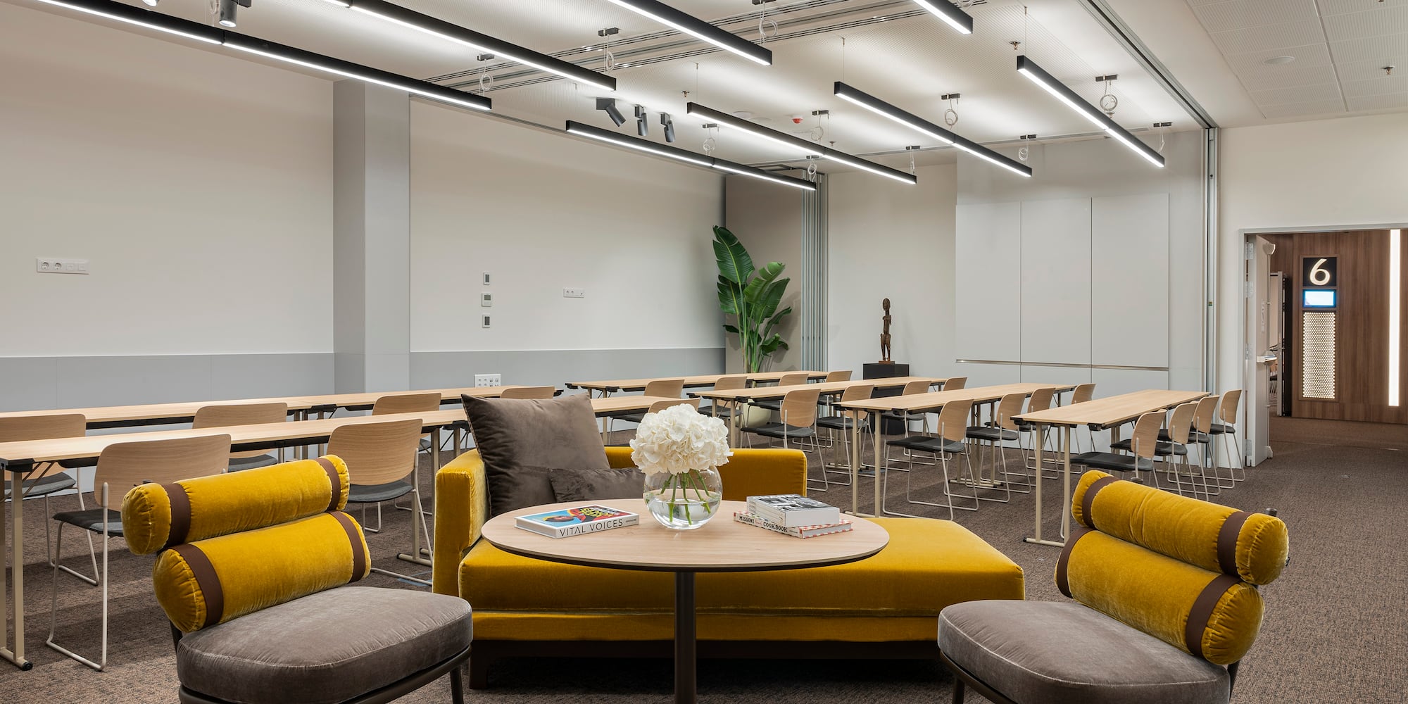 a room with chairs and tables