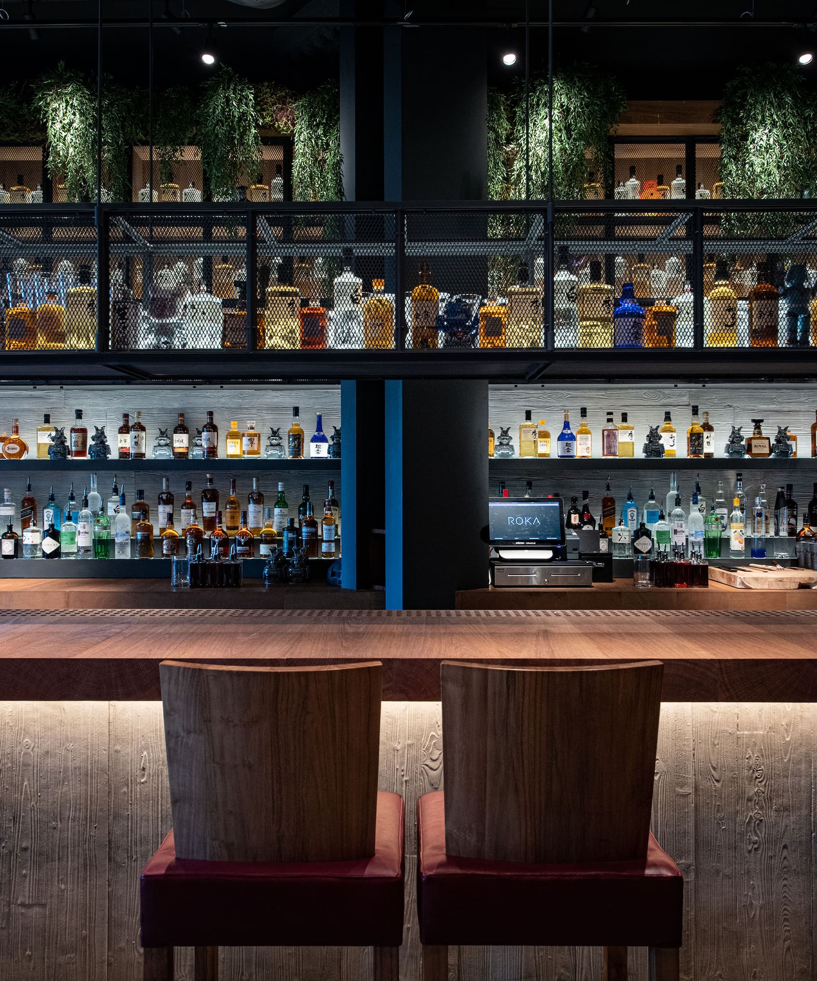 a bar with a shelf of liquor