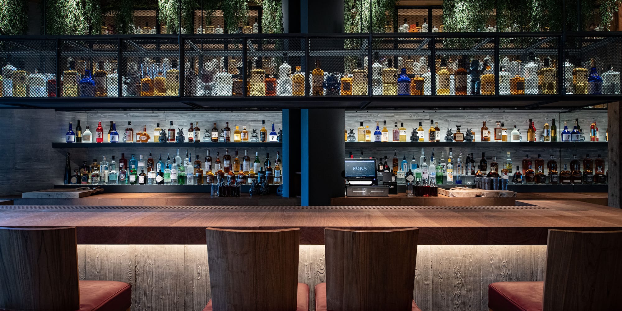 a bar with a shelf of liquor