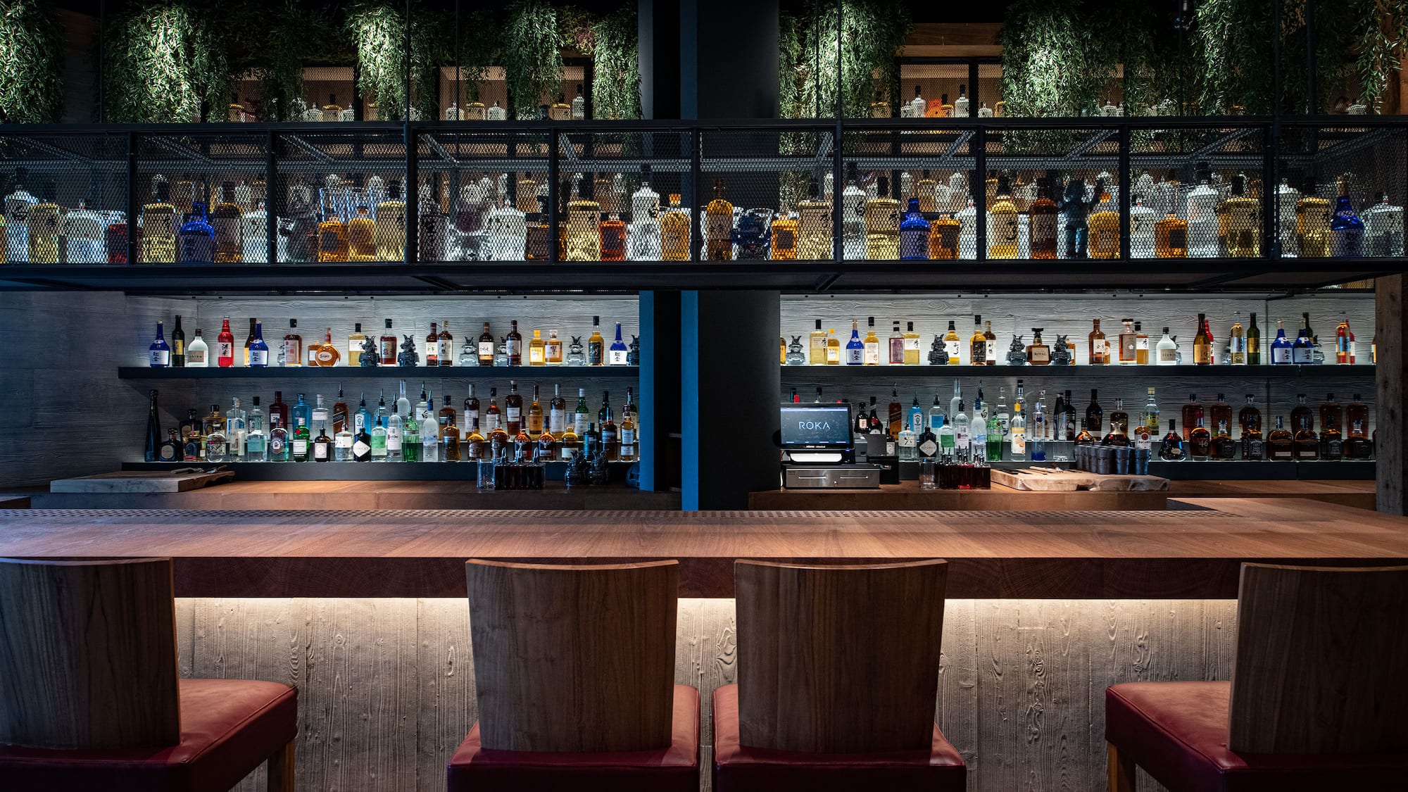 a bar with a shelf of liquor
