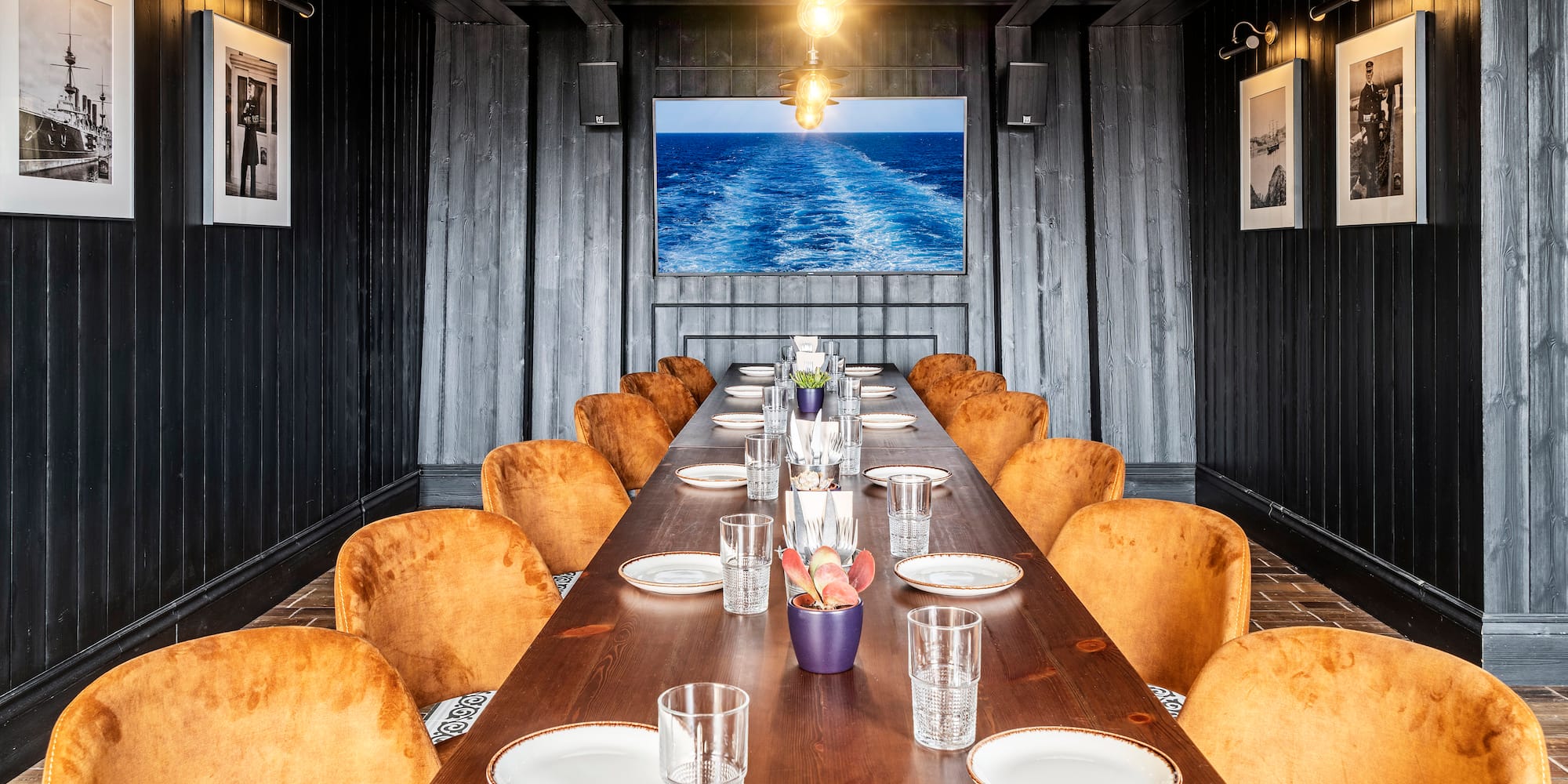 a long table with plates and glasses on it