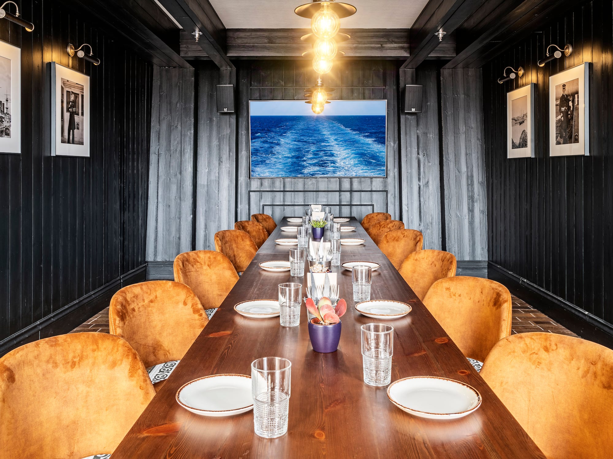 a long table with plates and glasses on it