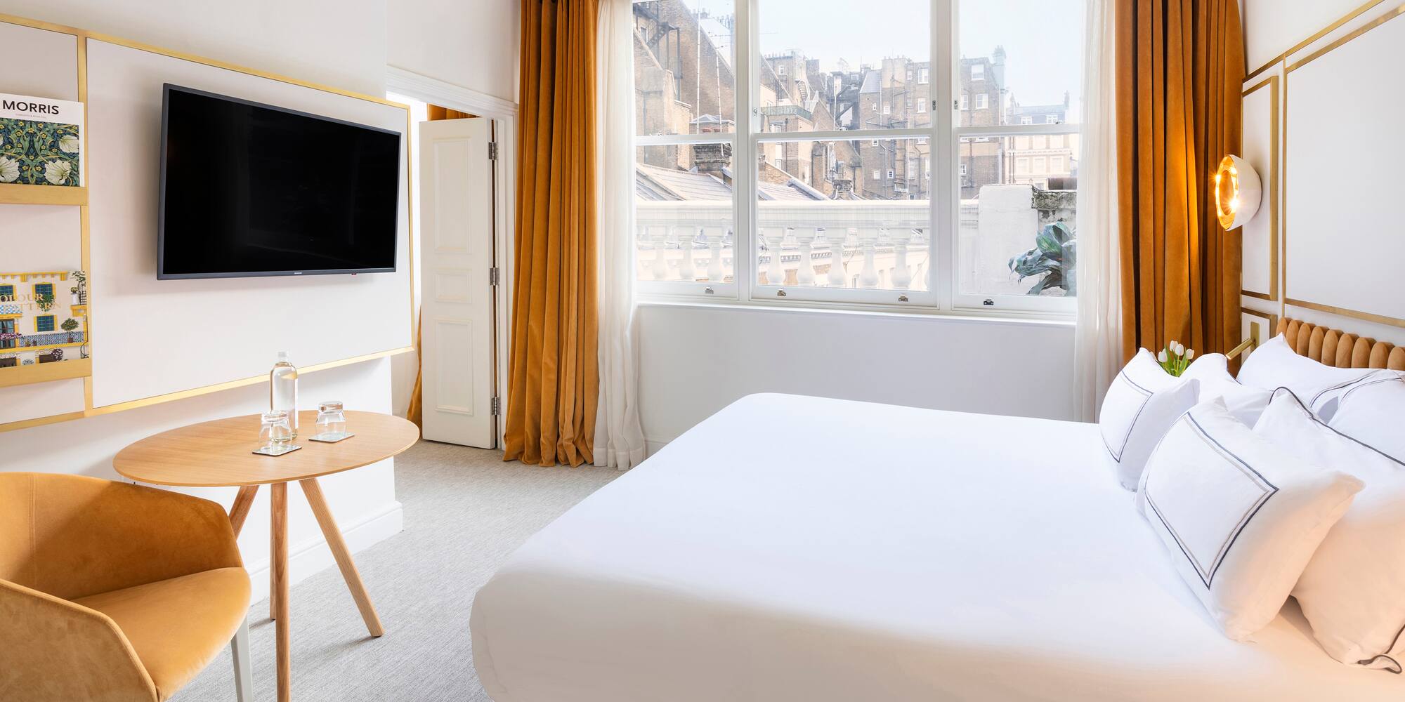 a room with a bed and a tv