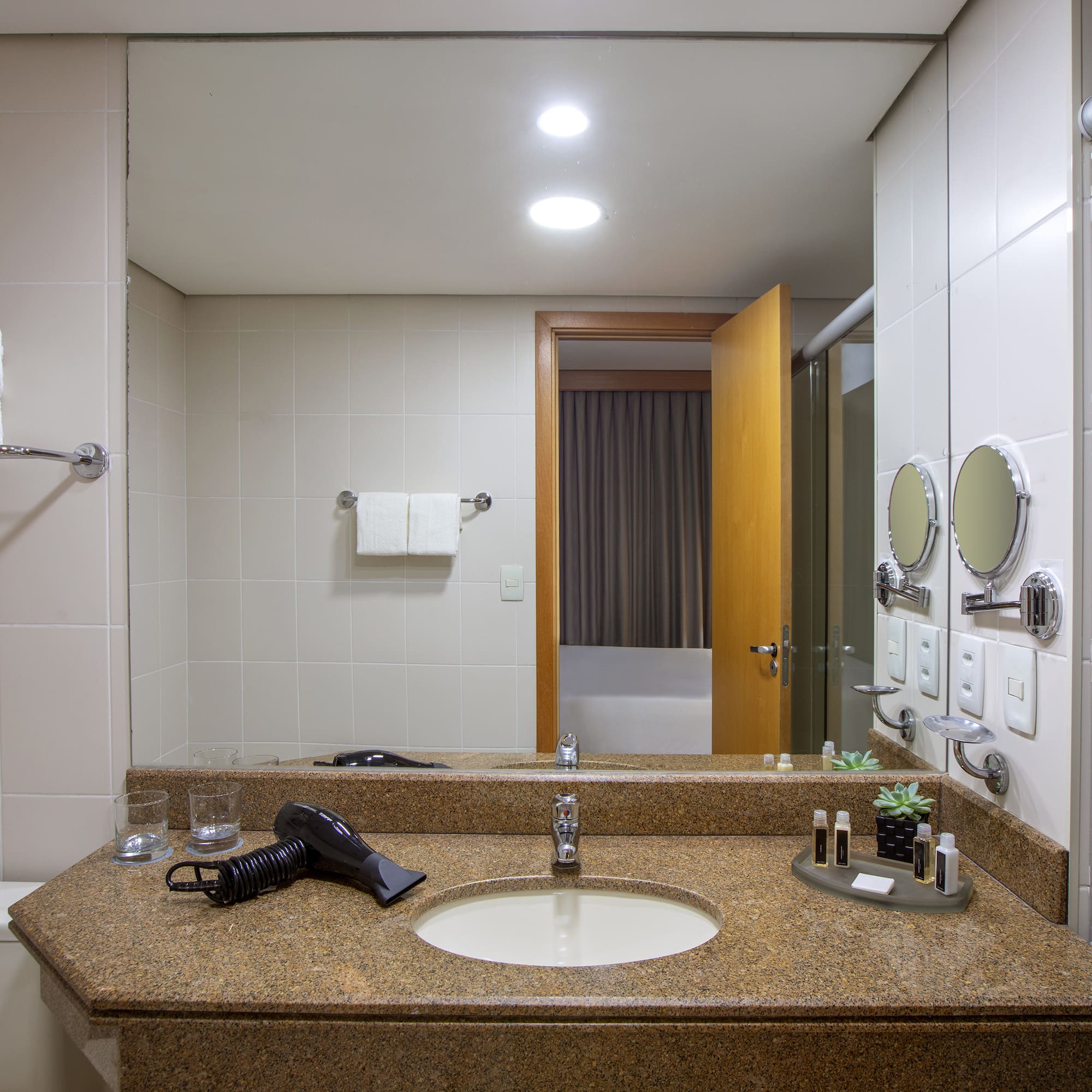 a bathroom with a sink and mirror