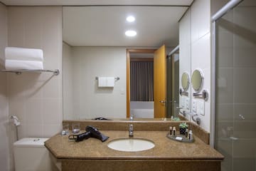 a bathroom with a sink and mirror