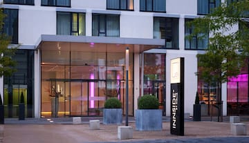 a building with glass walls and a sign