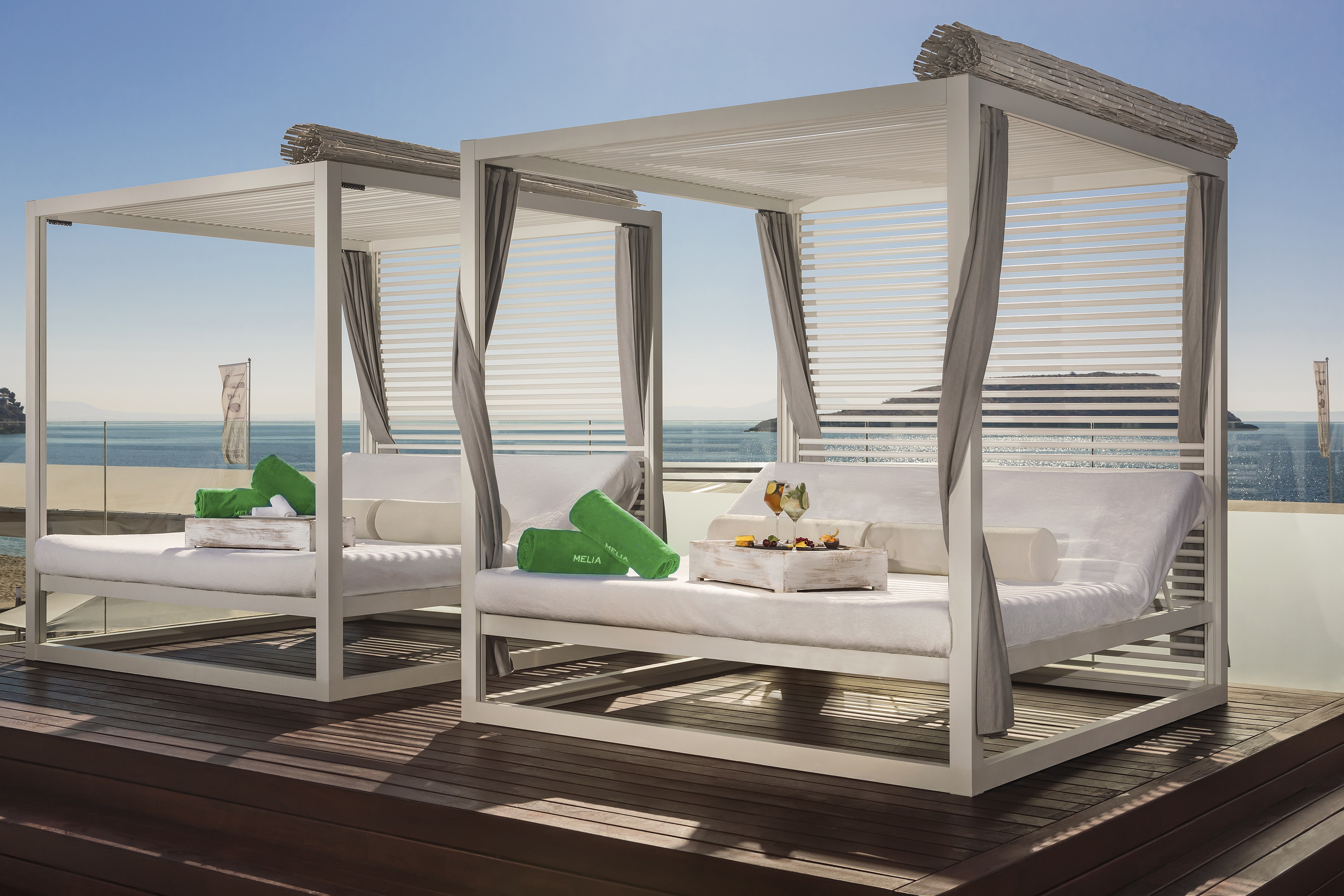 Melia luxury cabanas, wooden deck, ocean view, snacks, cocktails.