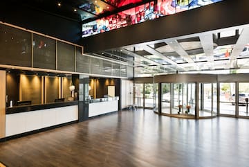 a lobby with glass doors and a large window