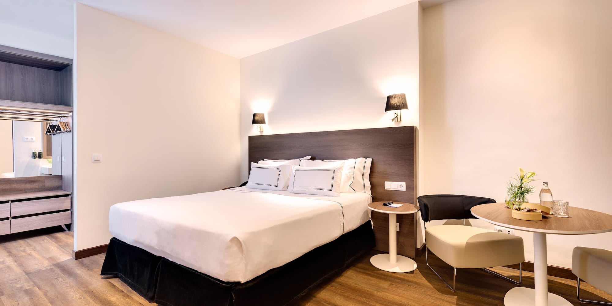 a bedroom with a bed and a table