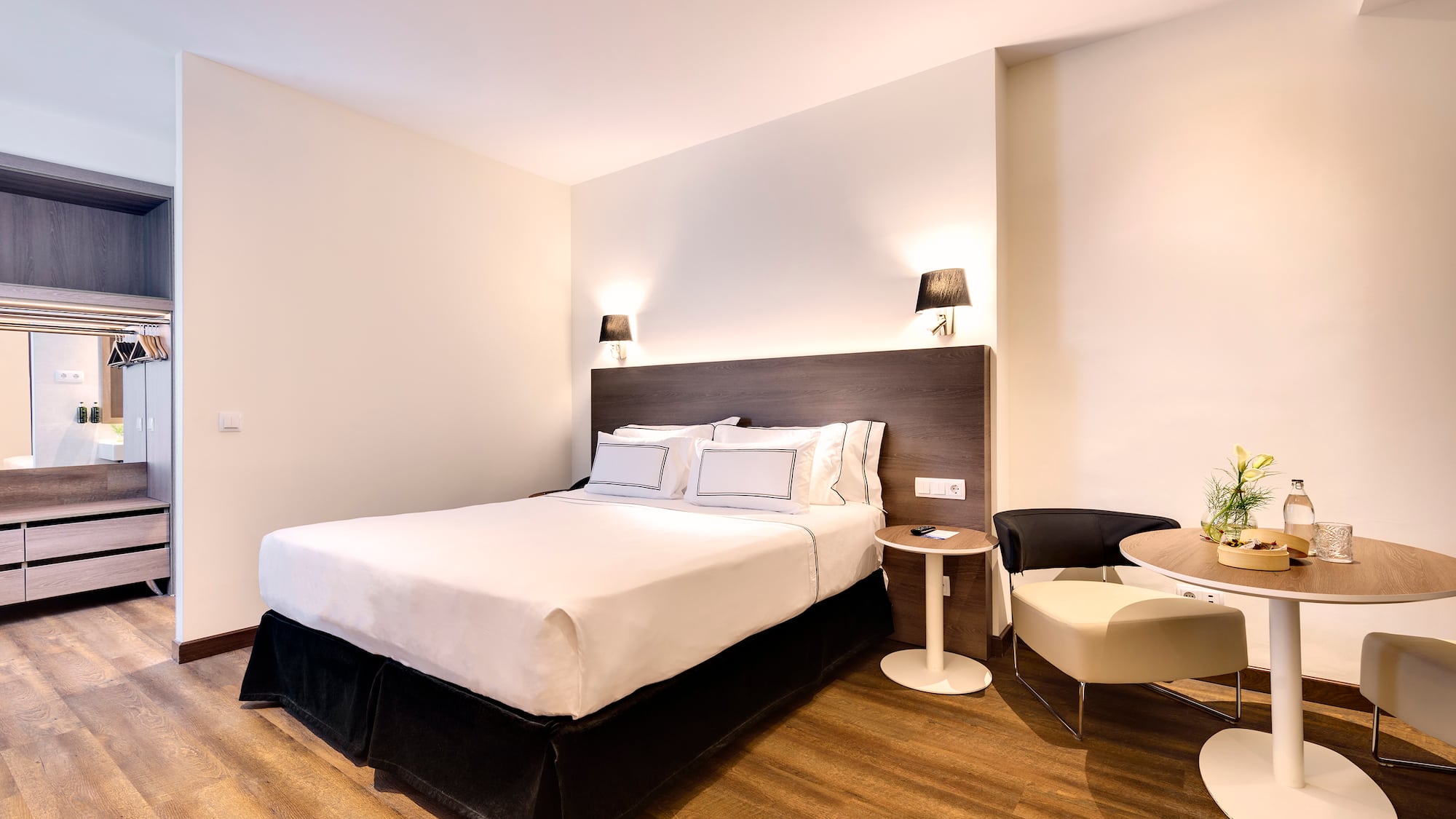 a bedroom with a bed and a table