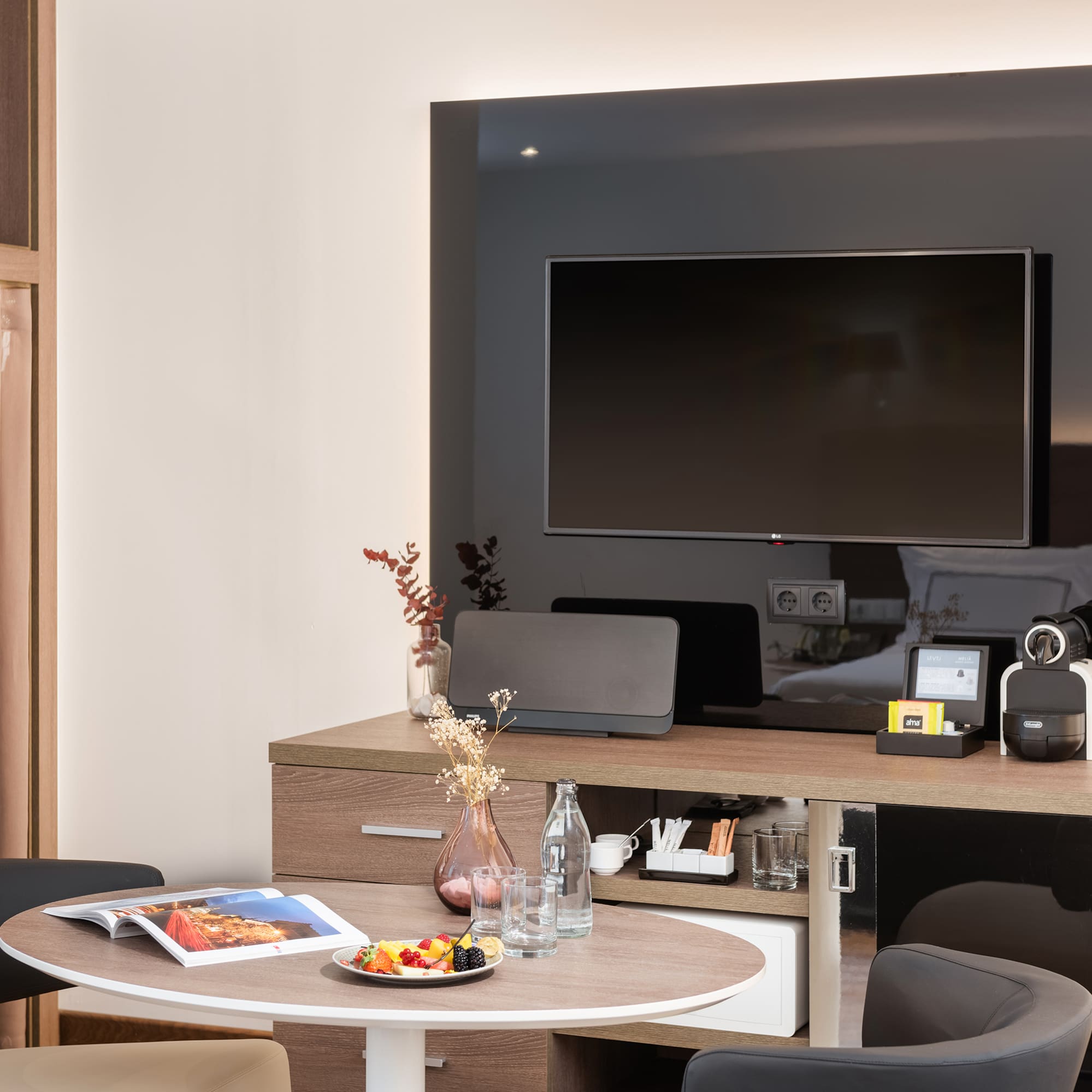 a room with a television and a table