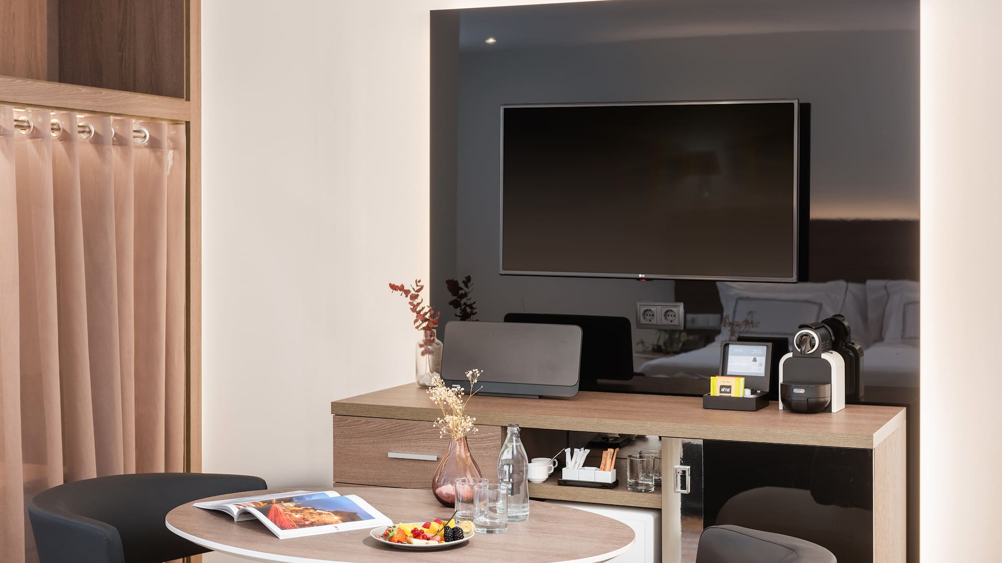 a room with a television and a table