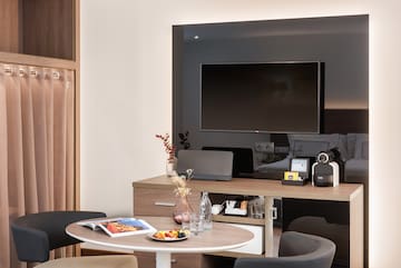 a room with a television and a table
